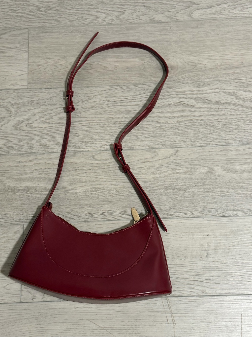 Charles & Keith Burgundy Crossbody Bag with Gold Accent